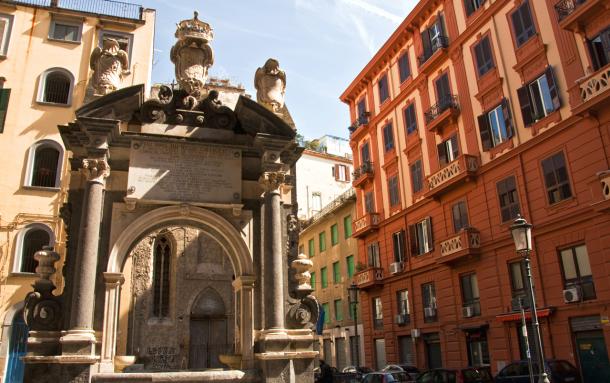 Naples street view with baroque monument