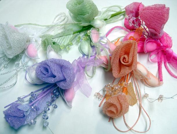 The basic Italian bomboniera is just a little organza or tulle sachet, but much more elaborate fabric, ceramic, metal or even crystal containers are also common. These colorful Colorful bomboniere by Maurizio Oriani