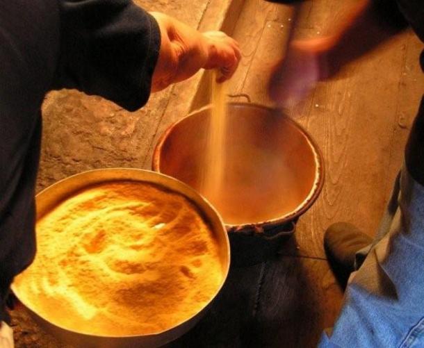 Making polenta at an outdoor fair in Italy