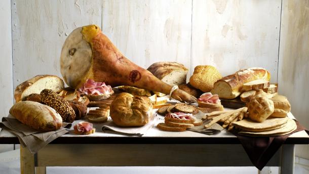 Prosciutto di San Daniele with an assortment of Italian artisanal breads. © Consorzio del Prosciutto di San Daniele Prosciutto di San Daniele and italian artisanal breads