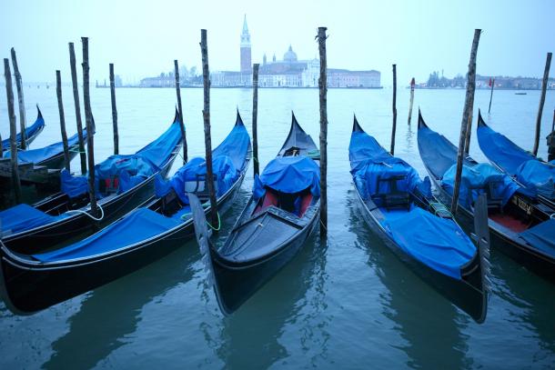 A panorama of Venice at dusk, the most romantic city in the world. © Hemera Technologies/AbleStock.com/Thinkstock A view of Venice with gondole